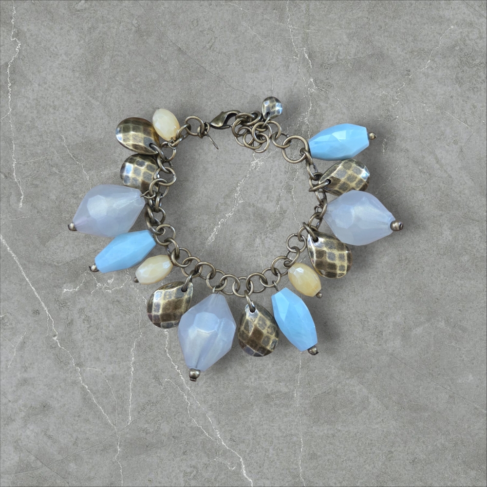 Premier Light Blue and Cream Charm Bracelet with Brass Accents